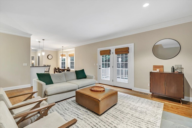 27 Bartlett Ln Unit 27, Shelton, CT 06484 - living room featuring ornamental molding, light wood finished floors, french doors, and recessed lighting