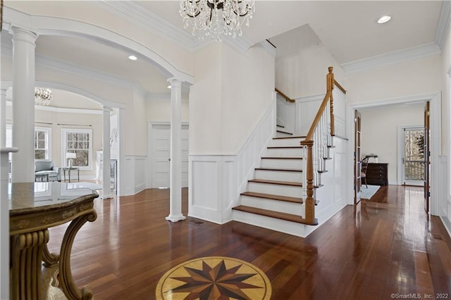 275 Chestnut Grv, Guilford, CT 06437 - entrance foyer with a decorative wall, wood-type flooring, decorative columns, wainscoting, and stairway