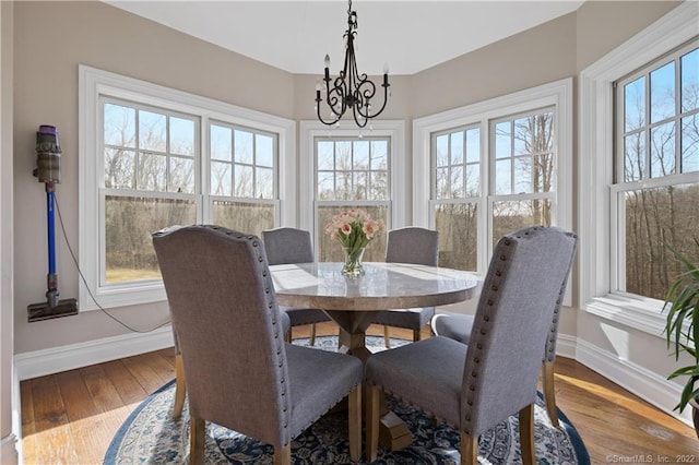 275 Chestnut Grv, Guilford, CT 06437 - dining room with a chandelier, healthy amount of natural light, and wood finished floors