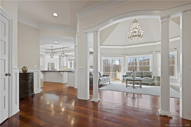 275 Chestnut Grv, Guilford, CT 06437 - entrance foyer with decorative columns, hardwood / wood-style flooring, a decorative wall, crown molding, and a wainscoted wall