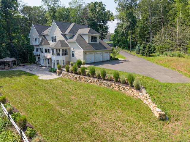 275 Chestnut Grv, Guilford, CT 06437 - view of front of home featuring a garage, a gazebo, a balcony, a front yard, and driveway
