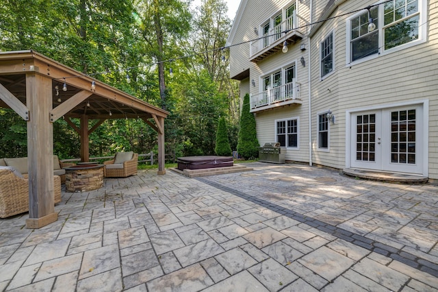 275 Chestnut Grv, Guilford, CT 06437 - patio / terrace with a covered hot tub, a fire pit, a gazebo, a patio area, and french doors