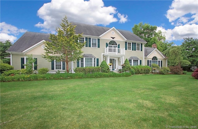 109 Davis Rd, Seymour, CT 06483 - view of front of home featuring a balcony, a chimney, and a front yard