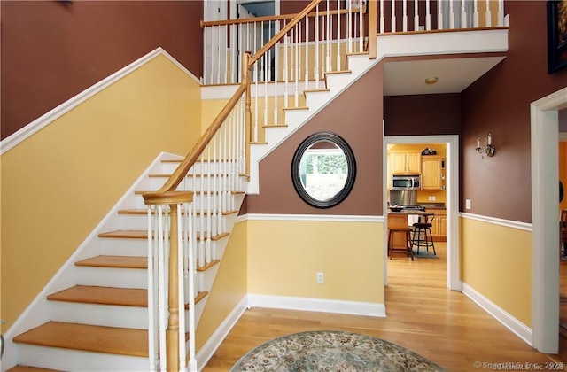 109 Davis Rd, Seymour, CT 06483 - stairs featuring wood finished floors and a high ceiling