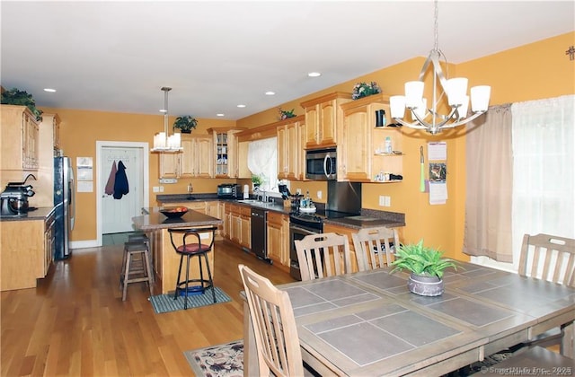 109 Davis Rd, Seymour, CT 06483 - dining area with a chandelier, wood finished floors, and recessed lighting