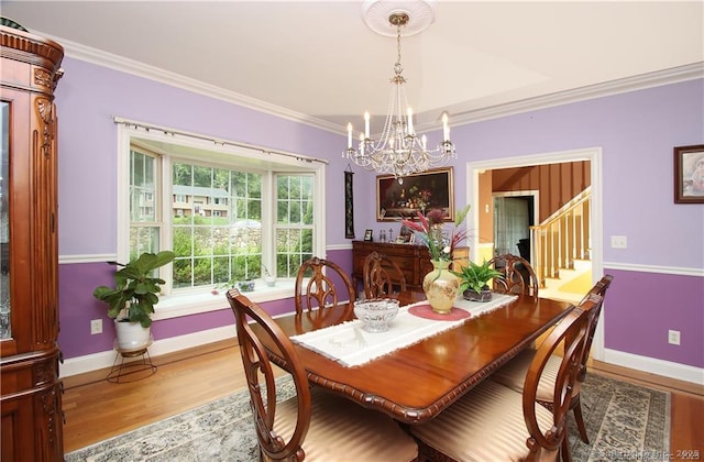 109 Davis Rd, Seymour, CT 06483 - dining area featuring a chandelier, wood finished floors, crown molding, and stairway