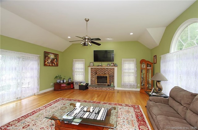 109 Davis Rd, Seymour, CT 06483 - living room with lofted ceiling, healthy amount of natural light, a ceiling fan, wood finished floors, and a fireplace