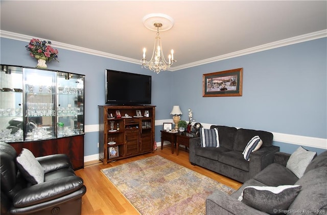 109 Davis Rd, Seymour, CT 06483 - living room featuring a chandelier, ornamental molding, and wood finished floors