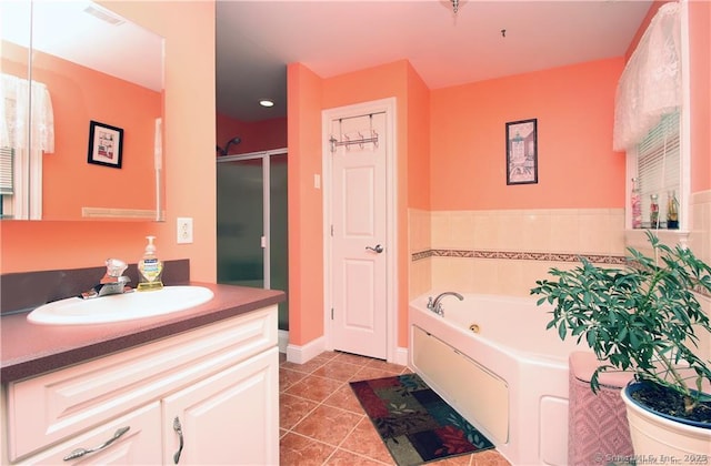 109 Davis Rd, Seymour, CT 06483 - bathroom featuring tile patterned floors, a tub with jets, vanity, and a stall shower