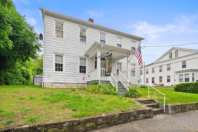 114 Prospect St, Norwich, CT 06360 - view of front facade featuring a chimney and a front yard