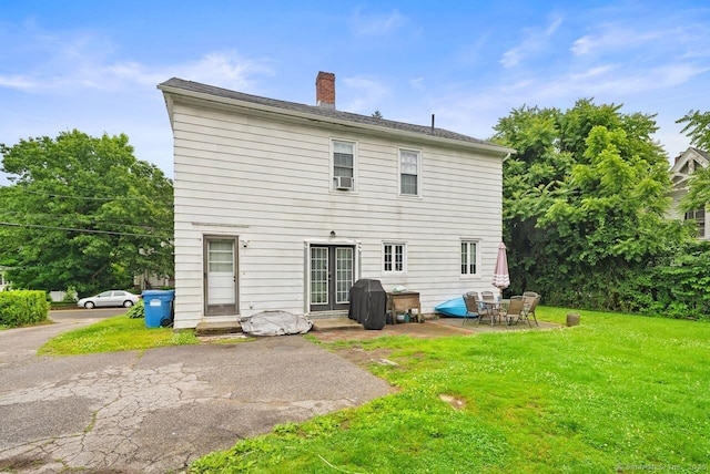 114 Prospect St, Norwich, CT 06360 - rear view of property featuring a patio, a yard, and a chimney