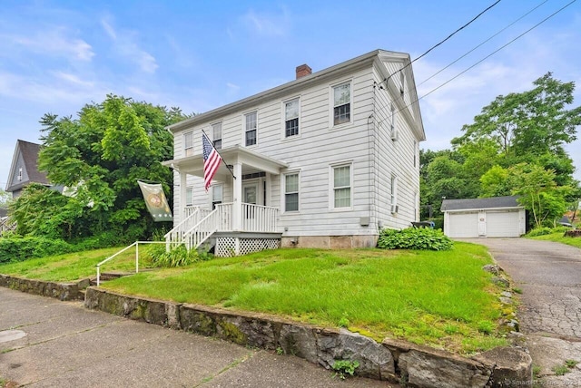 114 Prospect St, Norwich, CT 06360 - view of front facade featuring an outbuilding, a chimney, a porch, a detached garage, and a front yard