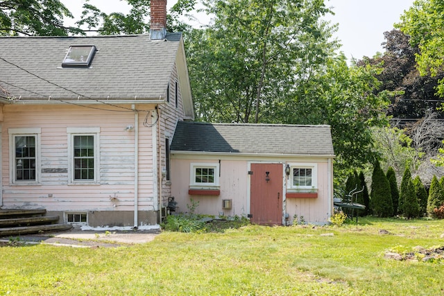 114 Spring St, Cheshire, CT 06410 - view of front of house with a chimney, a front lawn, and a shingled roof