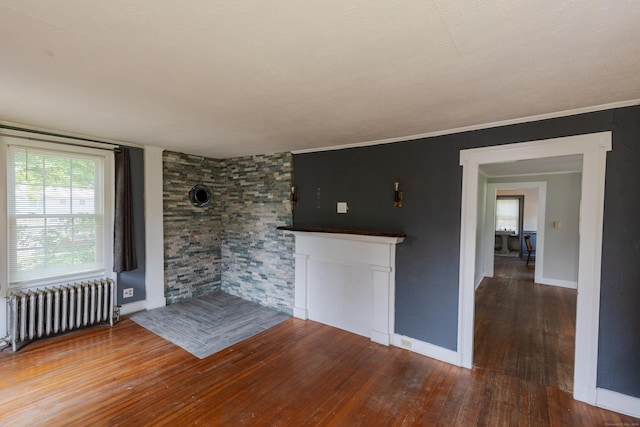 114 Spring St, Cheshire, CT 06410 - unfurnished room with radiator heating unit and hardwood / wood-style flooring