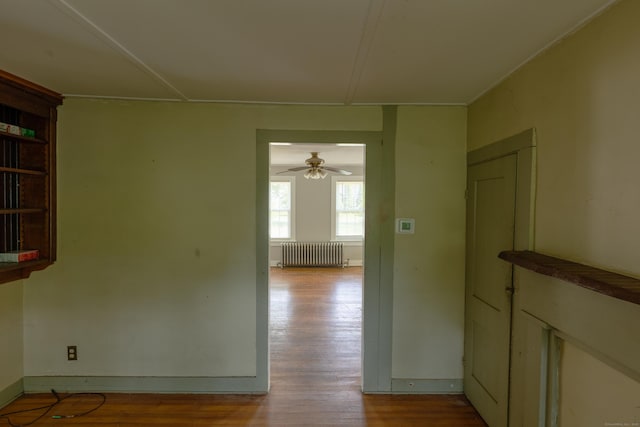 114 Spring St, Cheshire, CT 06410 - corridor featuring radiator heating unit and wood finished floors
