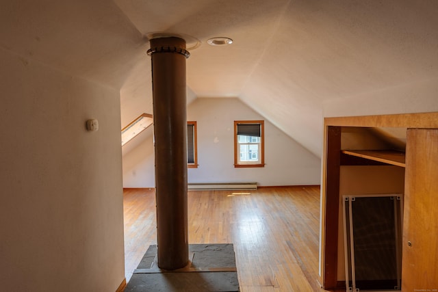 114 Spring St, Cheshire, CT 06410 - additional living space with baseboard heating, lofted ceiling, and wood-type flooring