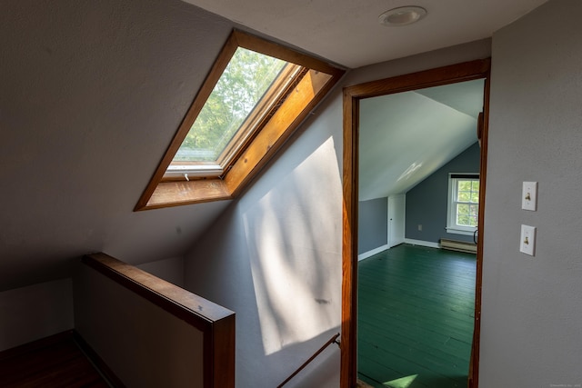 114 Spring St, Cheshire, CT 06410 - additional living space with a skylight, dark wood-style floors, vaulted ceiling, and baseboard heating