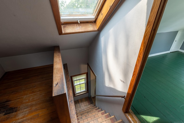 114 Spring St, Cheshire, CT 06410 - stairs featuring a skylight and hardwood / wood-style floors