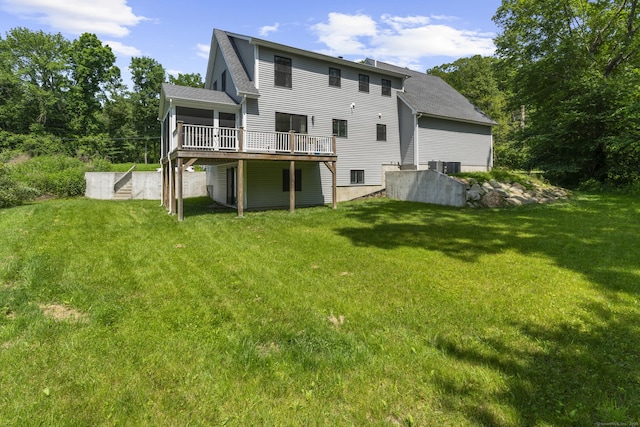 2 Sabrinas Ct, Norwich, CT 06360 - rear view of property with a lawn, a deck, roof with shingles, and a sunroom