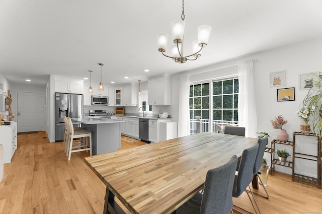 2 Sabrinas Ct, Norwich, CT 06360 - dining room with recessed lighting, a chandelier, and light wood-style floors