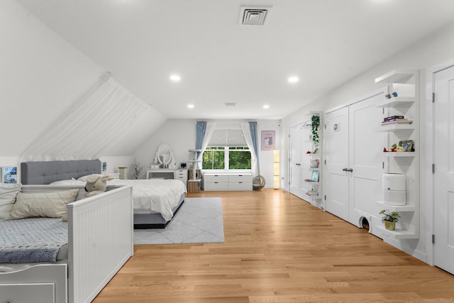 2 Sabrinas Ct, Norwich, CT 06360 - bedroom featuring light wood-style flooring, recessed lighting, vaulted ceiling, and multiple closets