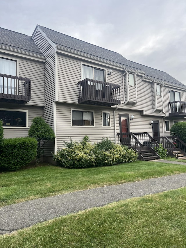 560 Yale Ave Unit 124, Meriden, CT 06450 - townhome / multi-family property featuring a balcony and a front lawn