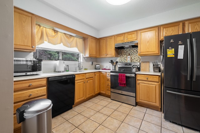 560 Yale Ave Unit 124, Meriden, CT 06450 - kitchen featuring black appliances, under cabinet range hood, light countertops, and light tile patterned floors