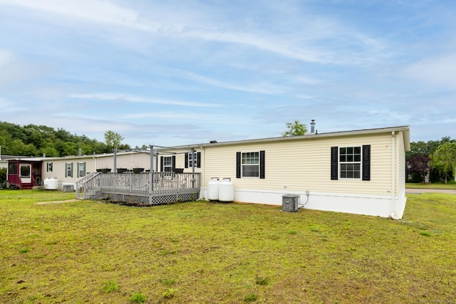 8 Haley Ln, Windham, CT 06256 - rear view of property with a deck and a lawn