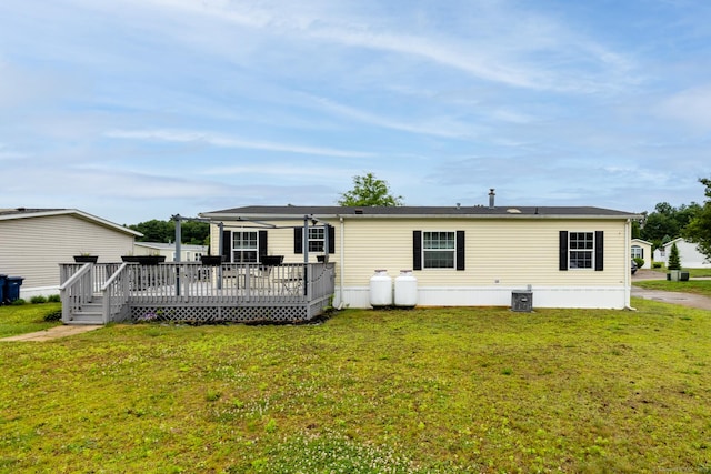 8 Haley Ln, Windham, CT 06256 - rear view of house with a wooden deck and a yard