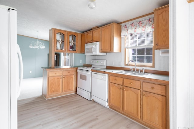 8 Haley Ln, Windham, CT 06256 - kitchen with white appliances, light wood finished floors, glass insert cabinets, a chandelier, and a peninsula