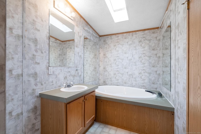8 Haley Ln, Windham, CT 06256 - full bathroom with ornamental molding, vanity, a garden tub, a textured ceiling, and a skylight