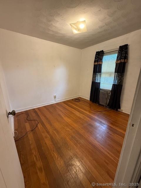 347 Weber St Unit 21Building 97, Stratford, CT 06614 - unfurnished room featuring wood finished floors and baseboards