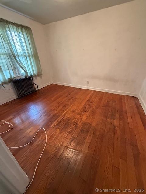 347 Weber St Unit 21Building 97, Stratford, CT 06614 - unfurnished room with hardwood / wood-style floors and radiator heating unit