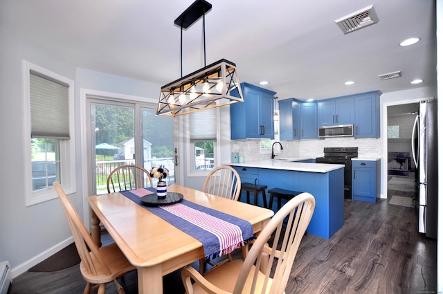 503 Mulberry St, Southington, CT 06479 - dining room with dark wood-type flooring, baseboard heating, and recessed lighting