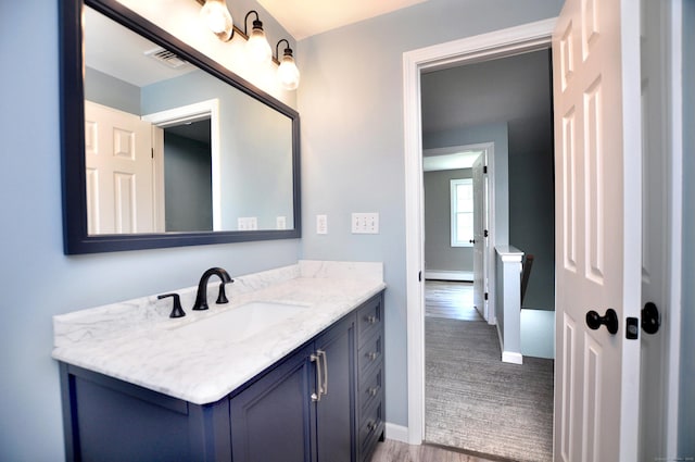 503 Mulberry St, Southington, CT 06479 - bathroom featuring vanity, wood finished floors, and a baseboard radiator