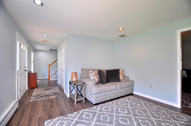 503 Mulberry St, Southington, CT 06479 - living area featuring baseboard heating, wood finished floors, stairs, and recessed lighting