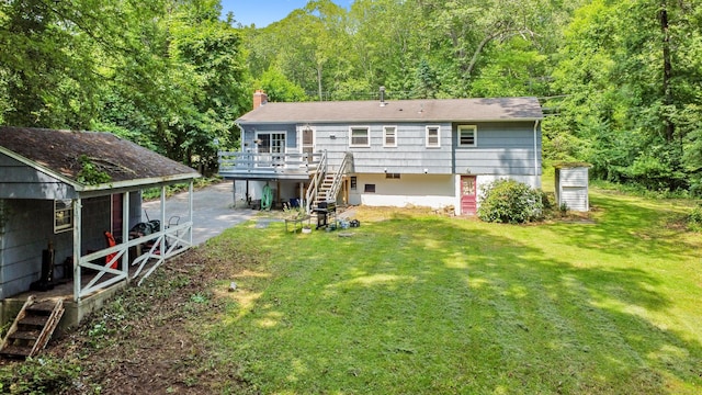 837 Long Cove Rd, Ledyard, CT 06335 - rear view of house with stairway, a yard, a wooden deck, a chimney, and a wooded view