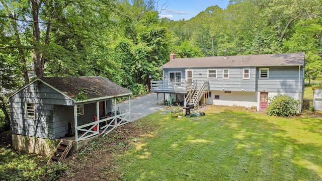 837 Long Cove Rd, Ledyard, CT 06335 - rear view of house with stairs, a lawn, a forest view, a chimney, and a deck