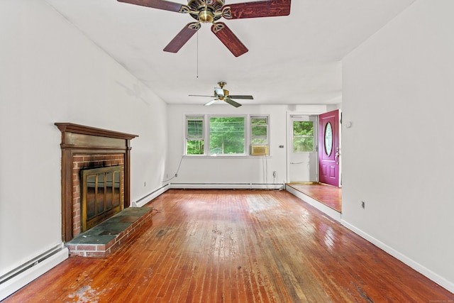 837 Long Cove Rd, Ledyard, CT 06335 - unfurnished living room with baseboard heating, a ceiling fan, hardwood / wood-style floors, a fireplace, and cooling unit