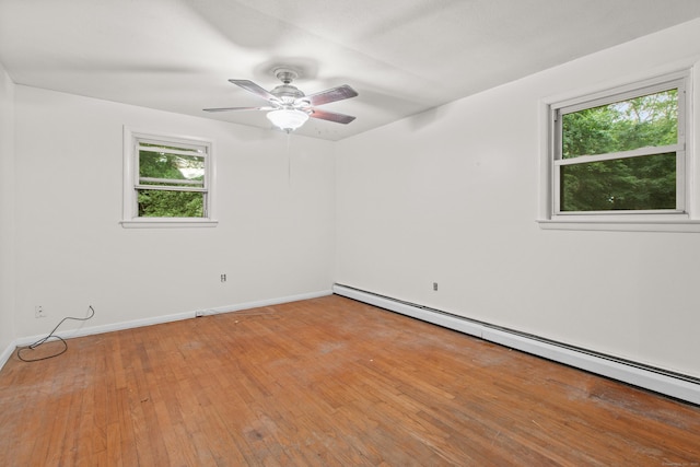 837 Long Cove Rd, Ledyard, CT 06335 - empty room featuring baseboard heating, plenty of natural light, a ceiling fan, and light wood-style flooring