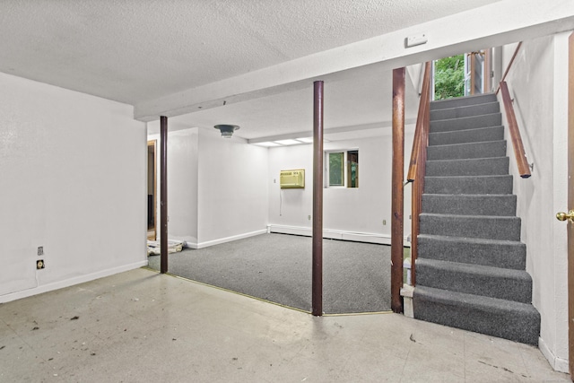 837 Long Cove Rd, Ledyard, CT 06335 - basement featuring stairs, a wall unit AC, a baseboard radiator, and a textured ceiling