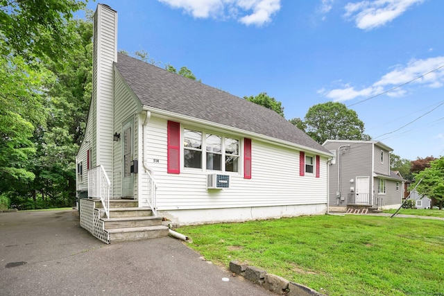 514 Peet St, Bridgeport, CT 06606 - view of front of home with a chimney, a front lawn, and a shingled roof
