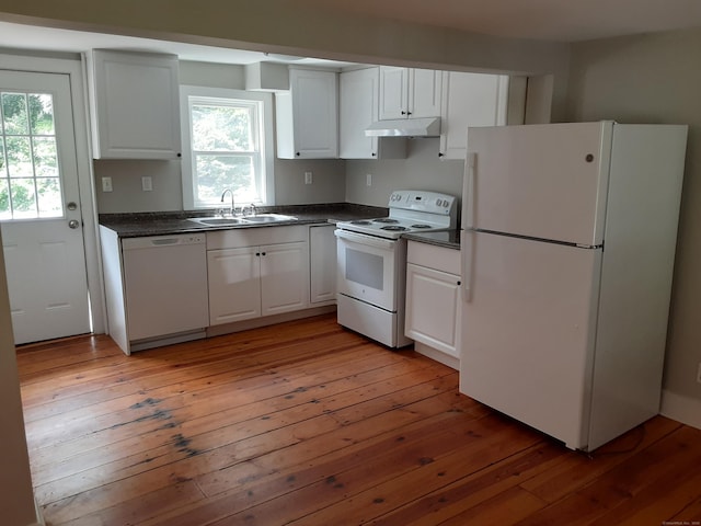 67 Hanover Rd, Newtown, CT 06470 - kitchen featuring white appliances, under cabinet range hood, dark countertops, and plenty of natural light