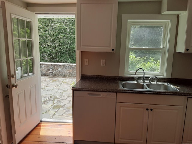 67 Hanover Rd, Newtown, CT 06470 - kitchen with white dishwasher, light wood-type flooring, and white cabinets