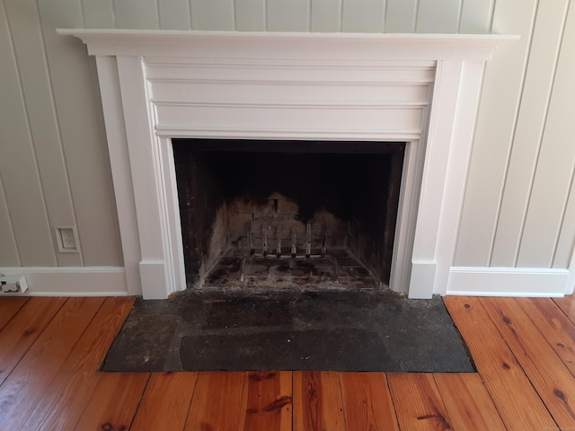 67 Hanover Rd, Newtown, CT 06470 - detailed view of a fireplace with flush hearth and wood finished floors