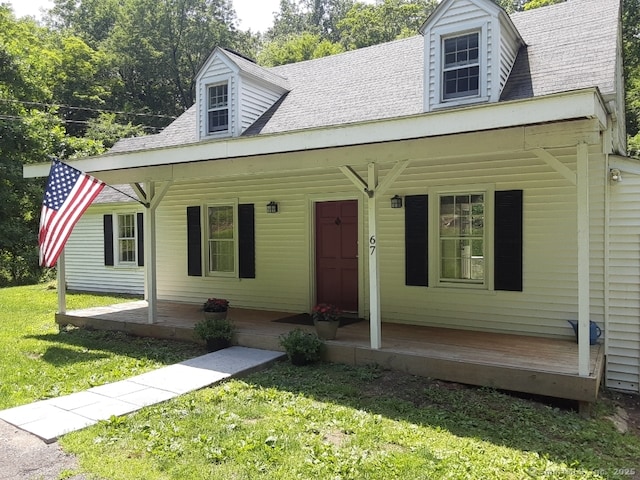 67 Hanover Rd, Newtown, CT 06470 - new england style home featuring a porch, a front yard, and a shingled roof