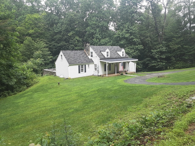 67 Hanover Rd, Newtown, CT 06470 - cape cod home featuring covered porch, a chimney, a front yard, and asphalt driveway