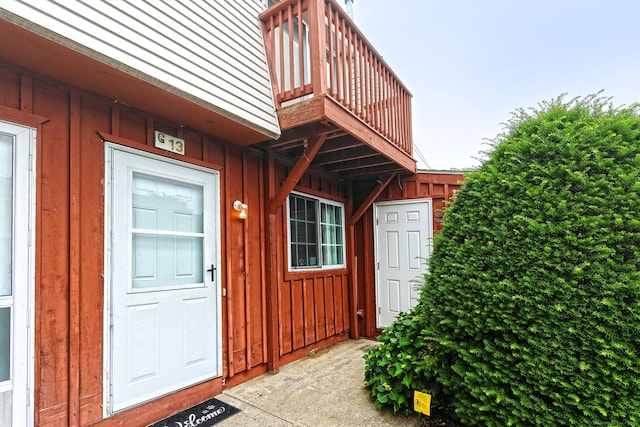 330 Short Beach Rd Apt G13, East Haven, CT 06512 - doorway to property featuring board and batten siding and a balcony