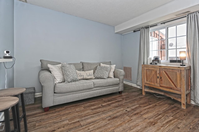 330 Short Beach Rd Apt G13, East Haven, CT 06512 - living room featuring dark wood finished floors and a textured ceiling