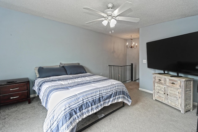 330 Short Beach Rd Apt G13, East Haven, CT 06512 - bedroom with carpet, a chandelier, a textured ceiling, and a ceiling fan